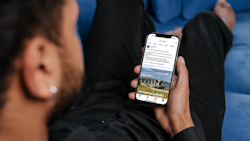 A man viewing a post on the One Suffolk Facebook page